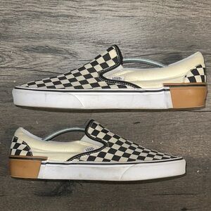Vans Black and Cream Slip-On Sneakers Iconic Design